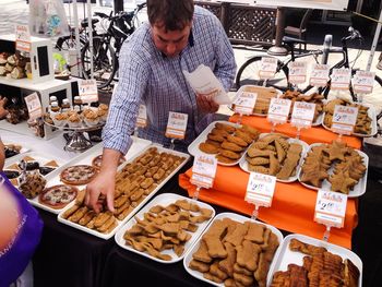 Midsection of man standing at market stall