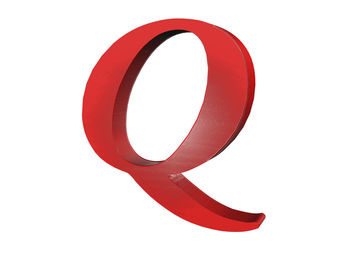 Close-up of red letter q against white background
