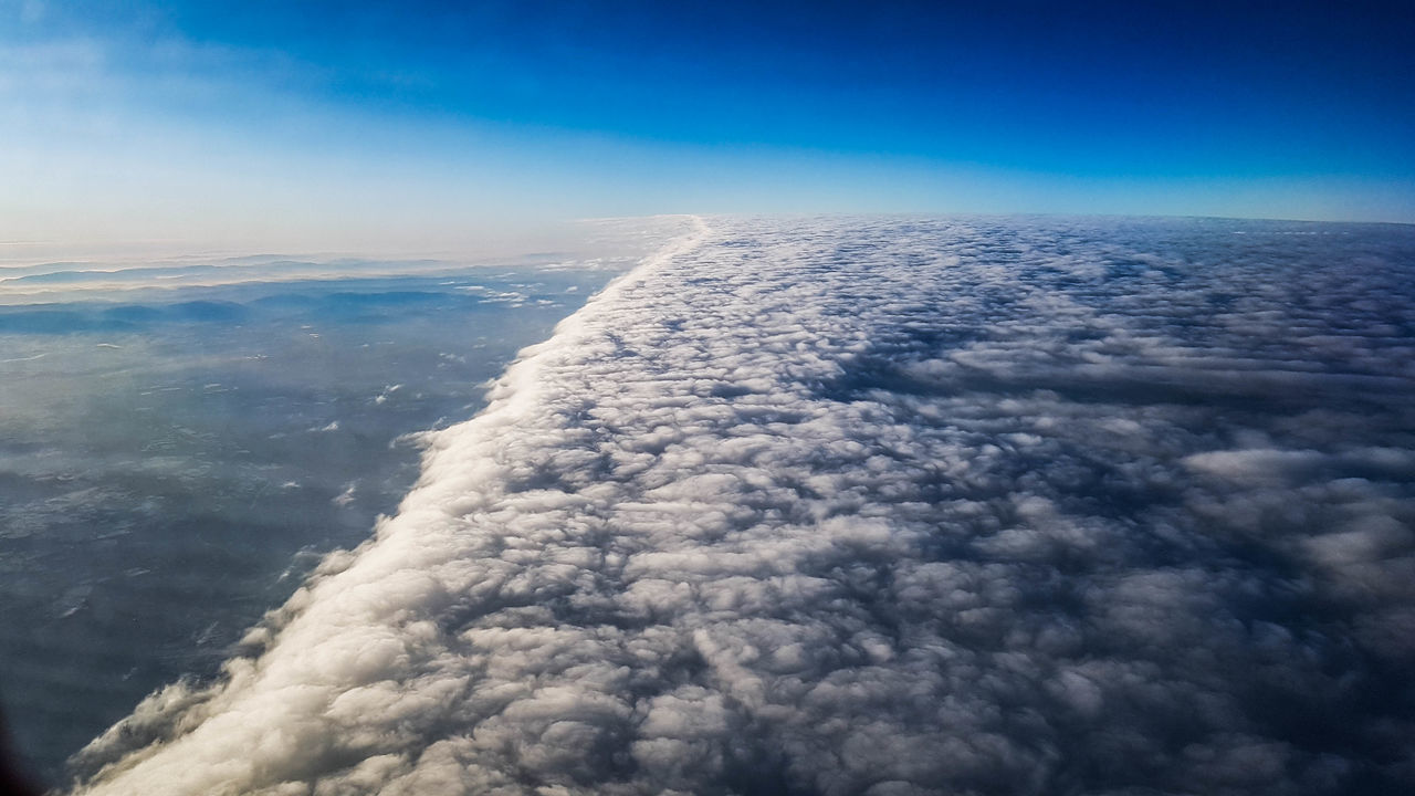 AERIAL VIEW OF CLOUDSCAPE OVER SEA AGAINST SKY