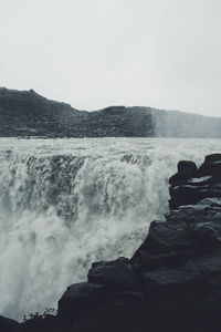 Waves splashing on rocks