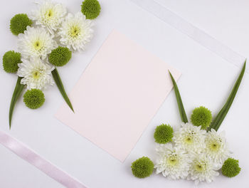 High angle view of white flower vase on table