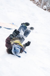 Low angle view of person falling on ski slope