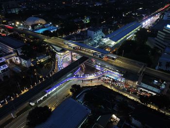 High angle view of illuminated buildings in city at night