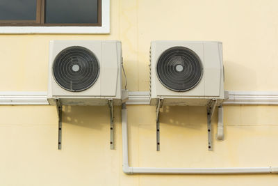 Full frame shot of electric fan on wall