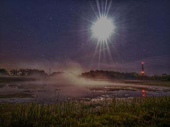 Scenic view of landscape against sky at night