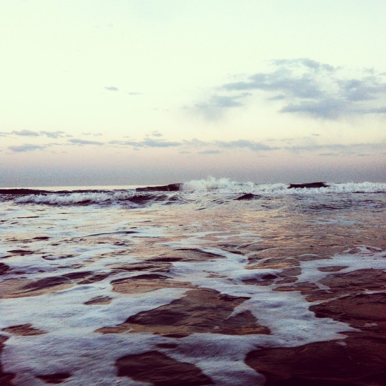 sea, water, horizon over water, beach, sky, scenics, wave, shore, beauty in nature, tranquil scene, tranquility, surf, nature, rock - object, cloud - sky, idyllic, motion, outdoors, coastline, remote