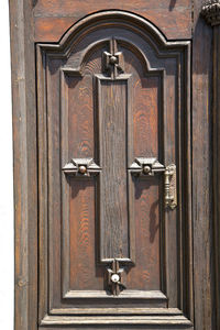 Full frame of wooden door with handle