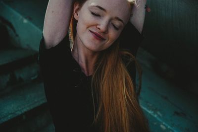 Portrait of young woman with eyes closed