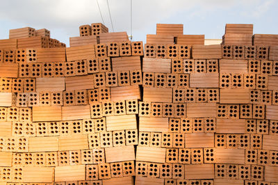 High angle view of stack of wood against sky