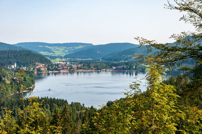 Scenic view of lake and mountains against sky