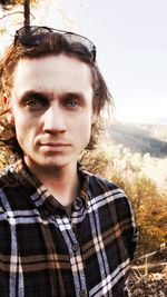 Portrait of young man standing on land