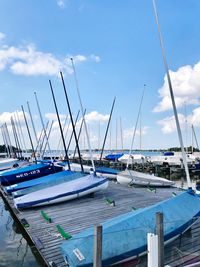 Sailboats moored in harbor