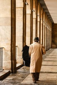 Rear view of woman walking on staircase