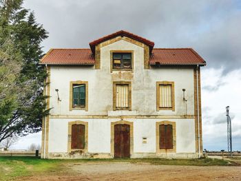 House on field against sky