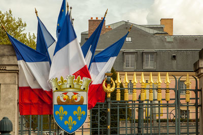 Low angle view of france flag against buildings in city