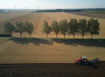Drone shots of a farmer ploughing his late summer field