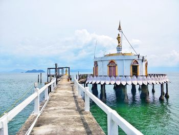 Pier over sea against sky