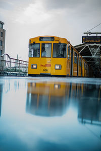 Train on bridge against sky