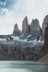 Scenic view of rocks in sea against sky. torres del paine. 