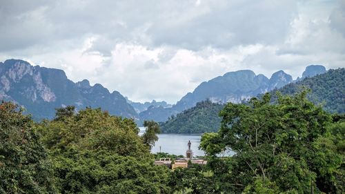 Scenic view of mountains against cloudy sky