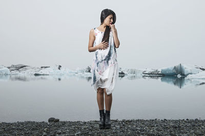 Beautiful woman posing for fashion photoshoot at glacierlagoon