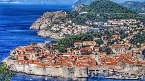 High angle view of townscape by sea