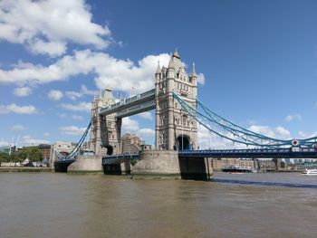Tower bridge over thames river against sky