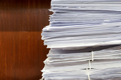 Close-up of stacked papers on table