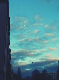 Low angle view of building against cloudy sky