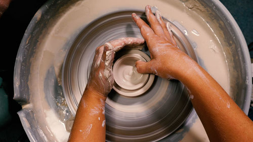 Cropped image of person washing hands