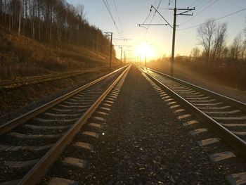 Surface level of railroad tracks against sky