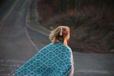 Rear view of woman with shawl