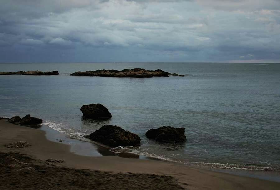 sea, horizon over water, water, sky, beach, tranquil scene, scenics, tranquility, beauty in nature, cloud - sky, shore, cloudy, nature, cloud, idyllic, rock - object, coastline, overcast, calm, sand