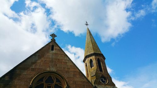 Low angle view of bell tower against sky