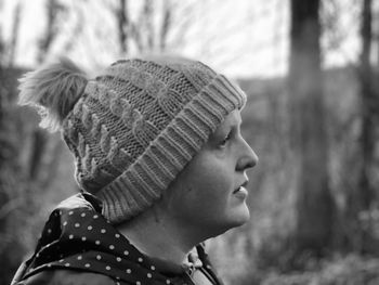 Close-up portrait of woman wearing hat