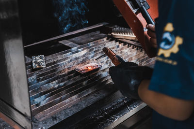 Low angle view of man working on fire