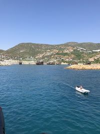 Scenic view of sea against clear blue sky