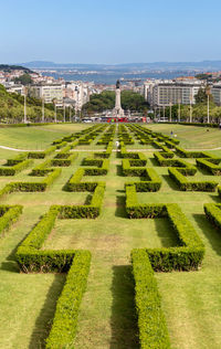 Scenic view of park against buildings in city