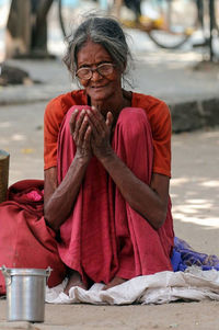 Mid adult woman sitting on floor