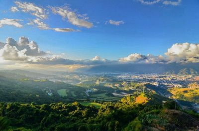 Scenic view of mountains against cloudy sky