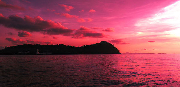 Scenic view of sea against romantic sky at sunset