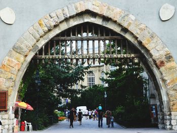 Rear view of people walking in building