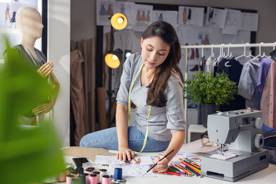 Portrait of woman working on table