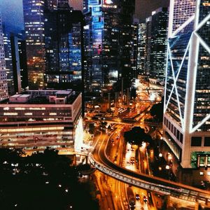 High angle view of city lit up at night