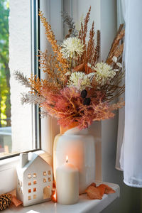 Sweet home. still life details in home on a wooden window. autumn decor on a window