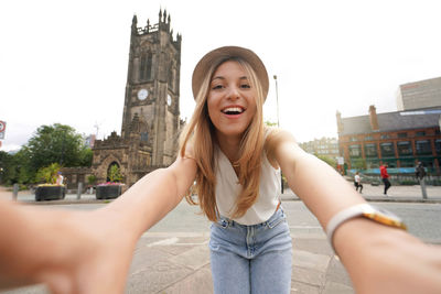 Attractive young woman takes self portrait in manchester, england, united kingdom