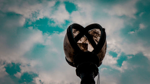 Low angle view of street light against sky