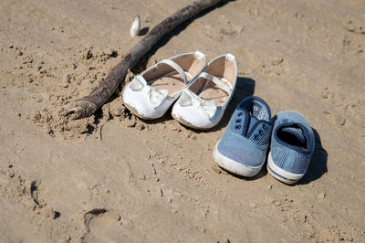 High angle view of shoes on sand