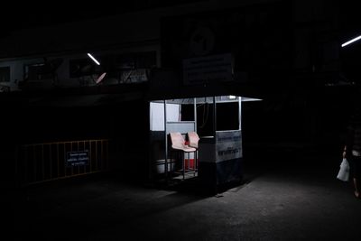Man standing in illuminated building