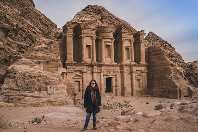 Woman standing in front of historical building